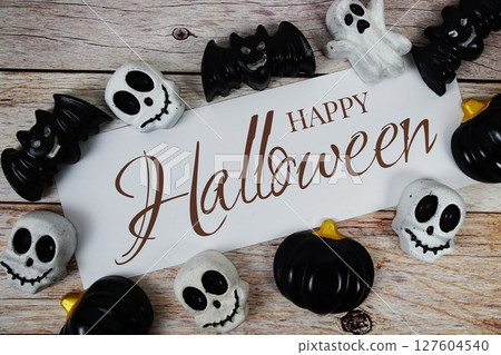 Happy Halloween text with element decorations on wooden background 127604540