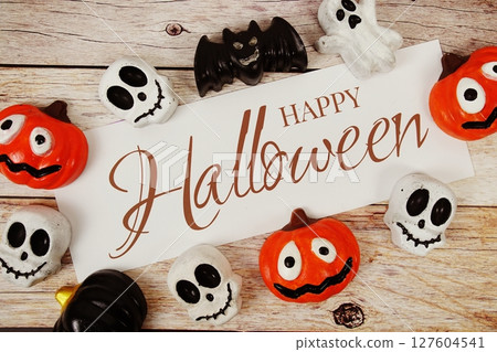 Happy Halloween text with element decorations on wooden background 127604541
