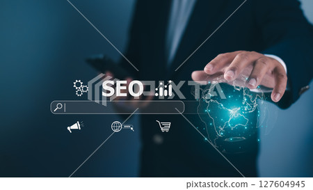 Businessman interacts with a holographic display SEO, e-commerce, global icons, Digital marketing, search engine optimization, online business, internet presence. Tech, marketing, global business. 127604945