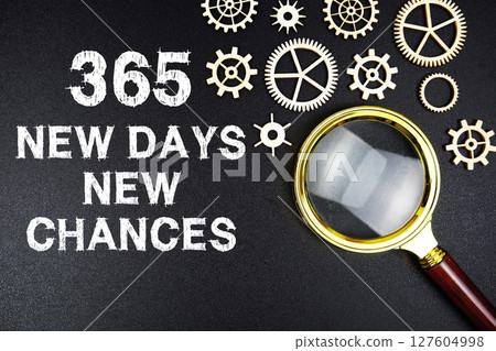 365 New Days 365 New Chances text message with magnifying glass on black background 127604998