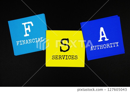 FSA - Financial Services Authority acronym text on sticky note on black background FSA - Financial Services Authority acronym text on sticky note on black background 127605043