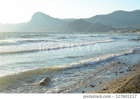 Background landscape view of Sudak Bay, the city of Sudak and its embankment in Crimea. 127605217