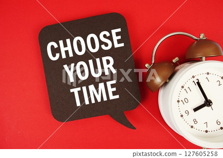 Choose Your Time text on speech bubble with alarm clock on red background 127605258