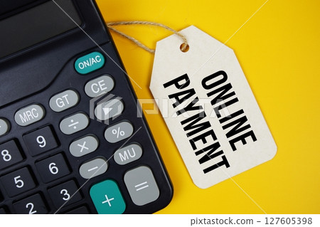 Online Payment text on price tag with calculator on yellow background 127605398