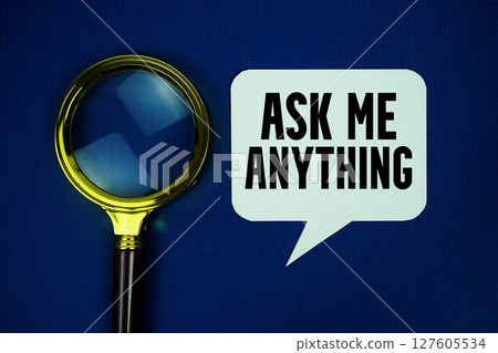 AMA Ask Me Anything text on speech bubble with magnifying glass top view on blue background 127605534