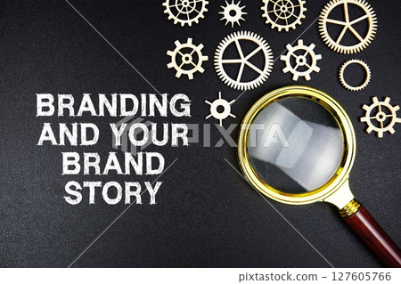Branding And Your Brand Story text message with magnifying glass on black background 127605766