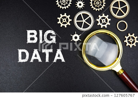 Big Data text message with magnifying glass on black background 127605767