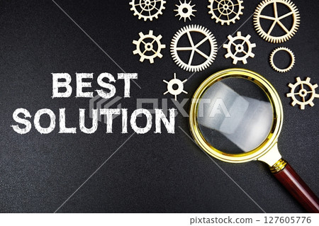 Best Solution text message with magnifying glass on black background 127605776