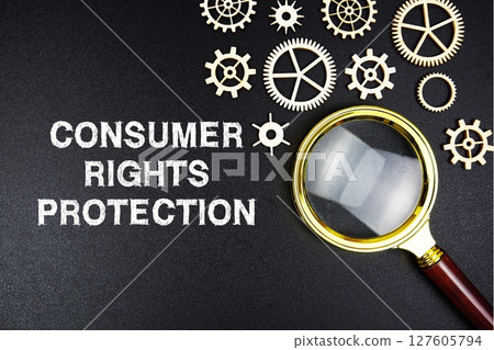 Consumer Rights Protection text message with magnifying glass on black background Consumer Rights Protection text message with magnifying glass on black background 127605794