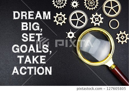 Dream Big, Set Goals, Take Action text message with magnifying glass on black background Dream Big, Set Goals, Take Action text message with magnifying glass on black background 127605805