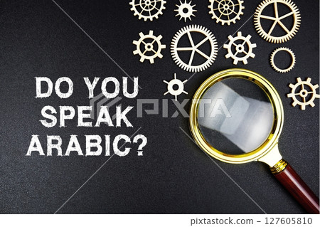 Do You Speak Arabic? text message with magnifying glass on black background 127605810
