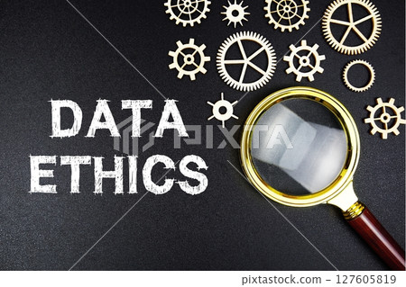 Data Ethics text message with magnifying glass on black background Data Ethics text message with magnifying glass on black background 127605819