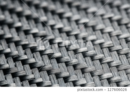 Horizontal photo of textured black carbon fiber panel 127606026