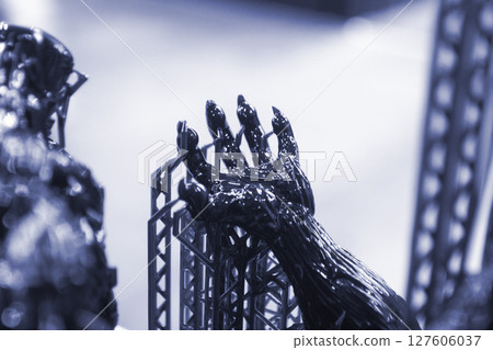An object printed on a 3D printer from hardened rubber close-up. Model black color created on a 3D printer from hardened rubber under influence of ultraviolet light. SLA 3D printing. Stereolithography An object printed on a 3D printer from hardened rubber close-up. Model black color created on a 3D printer from hardened rubber under influence of ultraviolet light. SLA 3D printing. Stereolithography 127606037
