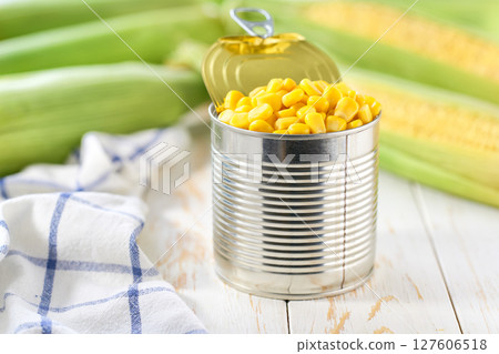 Canned food maize on a white table, selective focus. 127606518