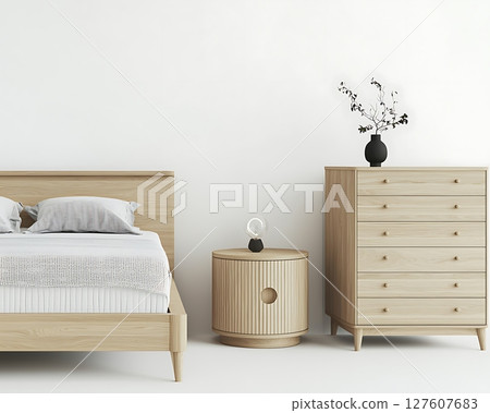 A bed and nightstand are shown in a white room 127607683