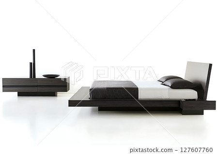 A bed with a black and white striped comforter A bed with a black and white striped comforter 127607760