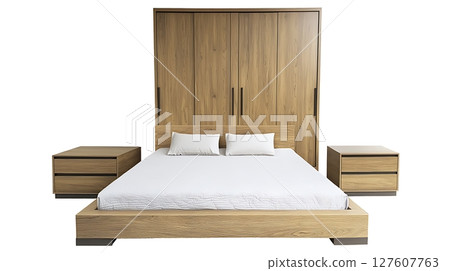 A wooden bed with a white sheet A wooden bed with a white sheet 127607763