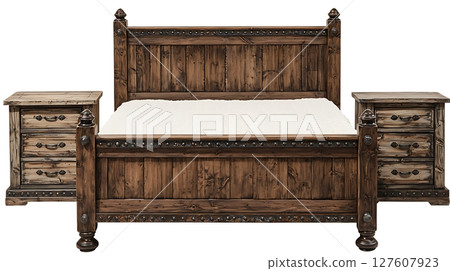 A wooden bed with a white pillow sits next to a wooden nightstand 127607923