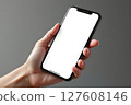 A hand holding a black iPhone with a white screen 127608146