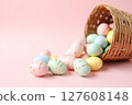 A basket full of Easter eggs in various colors and sizes 127608148