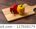 Colorful peppers on a cutting board 127608179