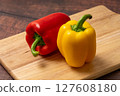 Colorful peppers on a cutting board 127608180
