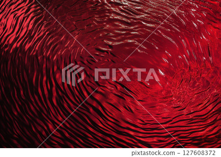 Rippling surface of red water reflecting light during sunset 127608372
