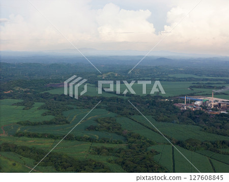 Green farmland with big factory Green farmland with big factory 127608845
