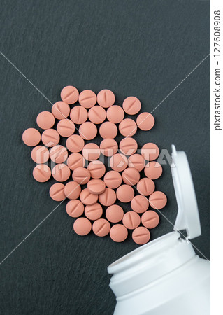 Much medical pills and drugs in white bottle. Healthcare concept. BAA or biologically active additives. 127608908