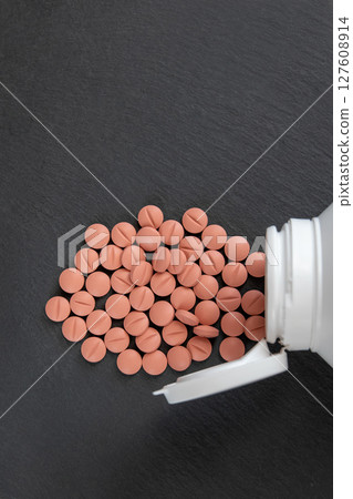 Much medical pills and drugs in white bottle. Healthcare concept. BAA or biologically active additives. Much medical pills and drugs in white bottle. Healthcare concept. BAA or biologically active additives. 127608914