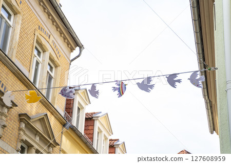 Charming and Enchanting Street adorned with Colorful Decorative Bunting and Urban Architecture 127608959