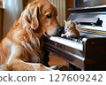 Dog and kitten huddled together in front of a piano Dog and kitten huddled together in front of a piano 127609242