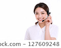 Smiling woman answering the phone Smiling woman answering the phone 127609248