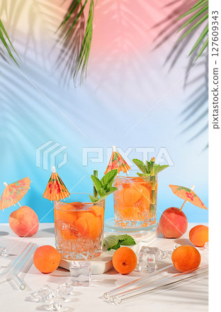 Modern still life with martini, alcoholic cocktail, peach, apricot and mint berries on elegant modern background, minimalist concept for bar and holiday party, cafe, advertising banner, 127609343