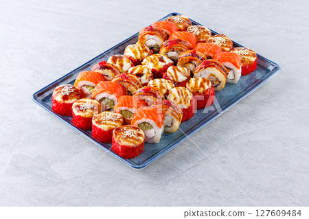Deluxe Assorted Sushi Platter with Baked Rolls and Salmon Nigiri 127609484