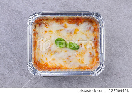 Homemade Chicken Lasagna Baked with Cheese and Fresh Basil Leaves 127609498