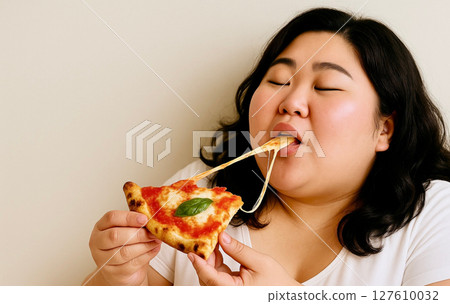 Chubby woman stuffing her mouth with pizza with stretchy cheese | Appetite, happy meal scene, fast food image 127610032
