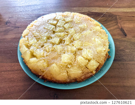 Homemade pineapple upside down pie with candied cherries . Tropical dessert on white background Homemade pineapple upside down pie with candied cherries . Tropical dessert on white background 127610621