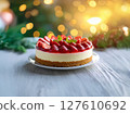 Sweet cake with strawberries on plate on grey wooden background 127610692