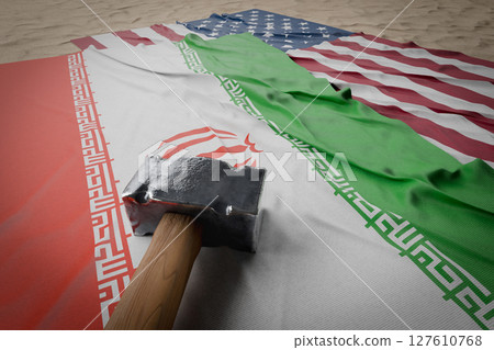 Large Hammer, American And Iranian Flags Resting on Desert Sand. Large Hammer, American And Iranian Flags Resting on Desert Sand. 127610768