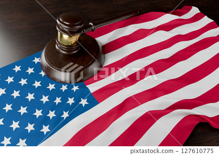 American Flag and Wooden Gavel Resting on Desk. 127610775
