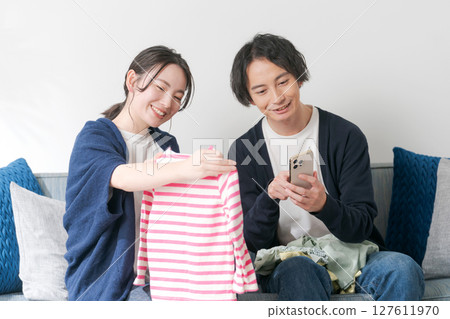 A couple sorting out unnecessary items 127611970