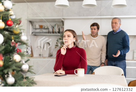 Two men quarreling with young woman 127612332