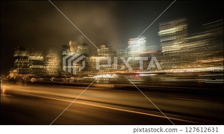 car running in the city at night 127612631