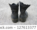 Worn jungle boots 127613377