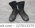 Worn jungle boots 127613379