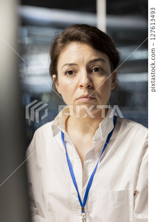 Data center software developer analyzing program logs metrics, optimizing storage systems. Close up of server hub IT specialist inspecting resource utilization, managing application efficiency 127613493