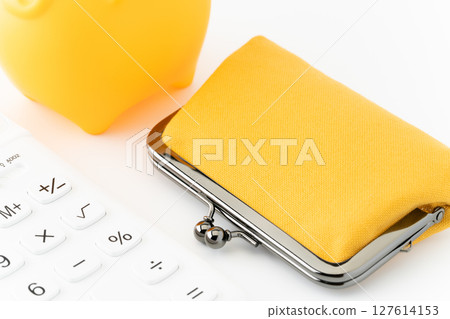 Calculator, yellow piggy bank and purse on white background 127614153