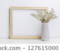 Dried flowers in a vase with a wooden frame 127615000